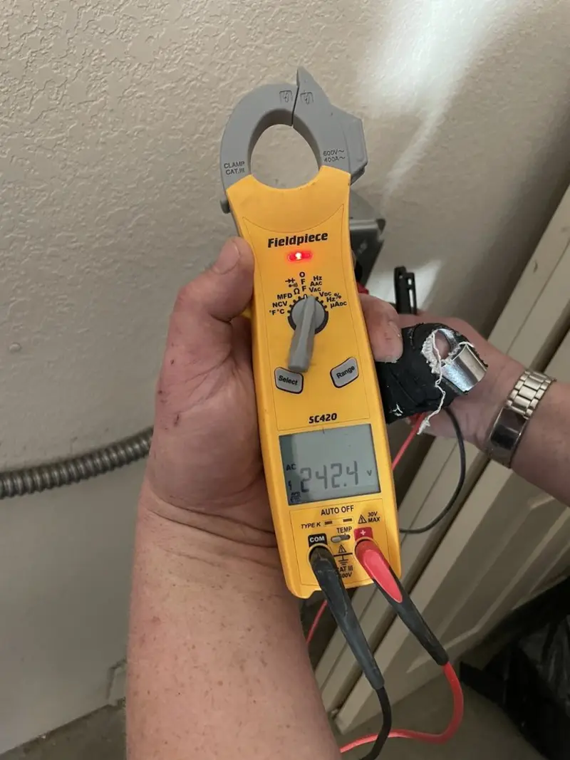 Voltage testing with clamp meter during Recessed Lighting Installation in Collier